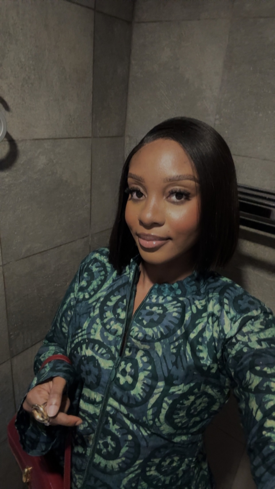 Stephanie in a green patterned outfit.